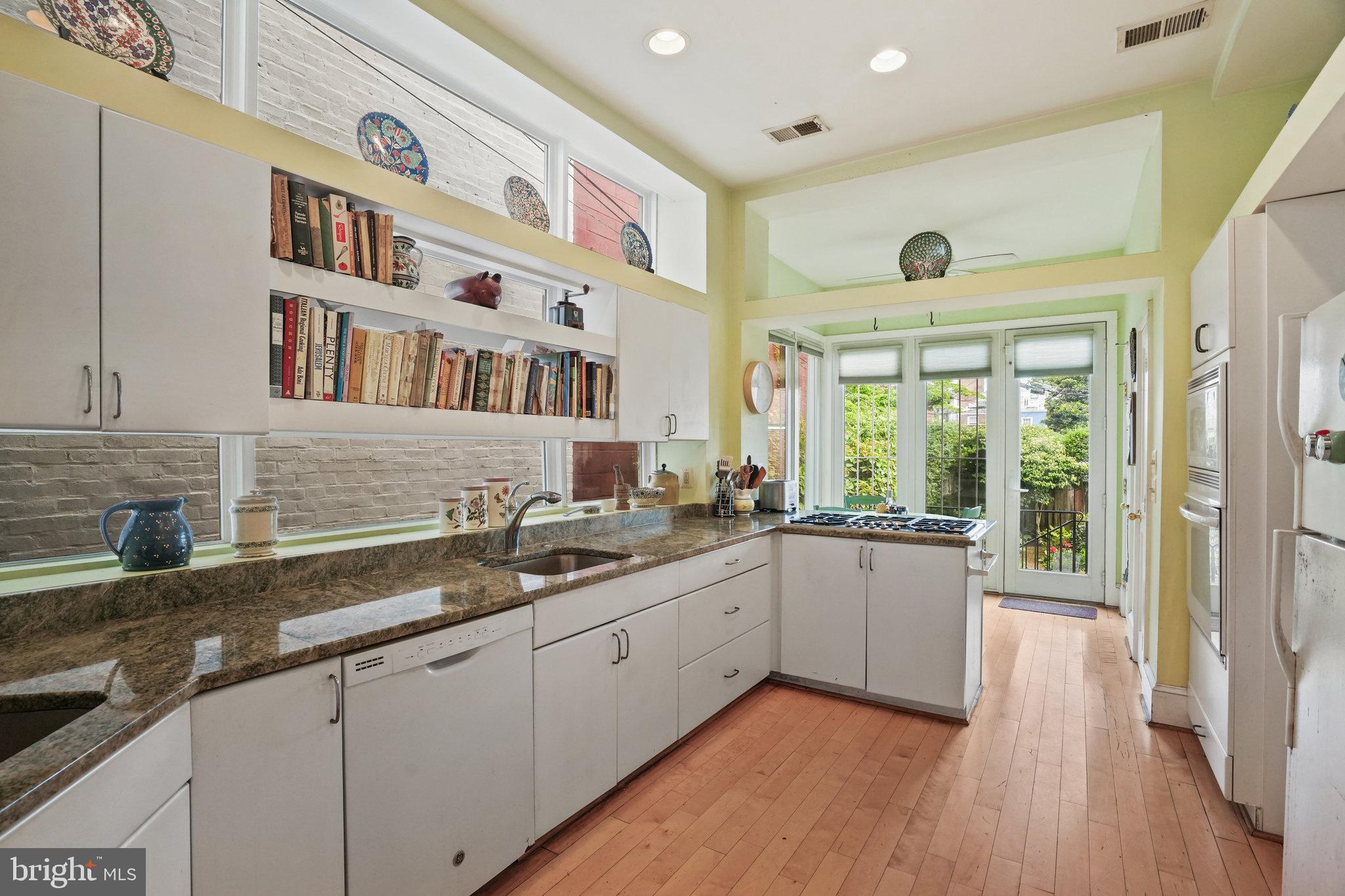 628 A Street Northeast Washington, DC 20002 - Photo 6 of 29 a kitchen with a sink and wooden floor