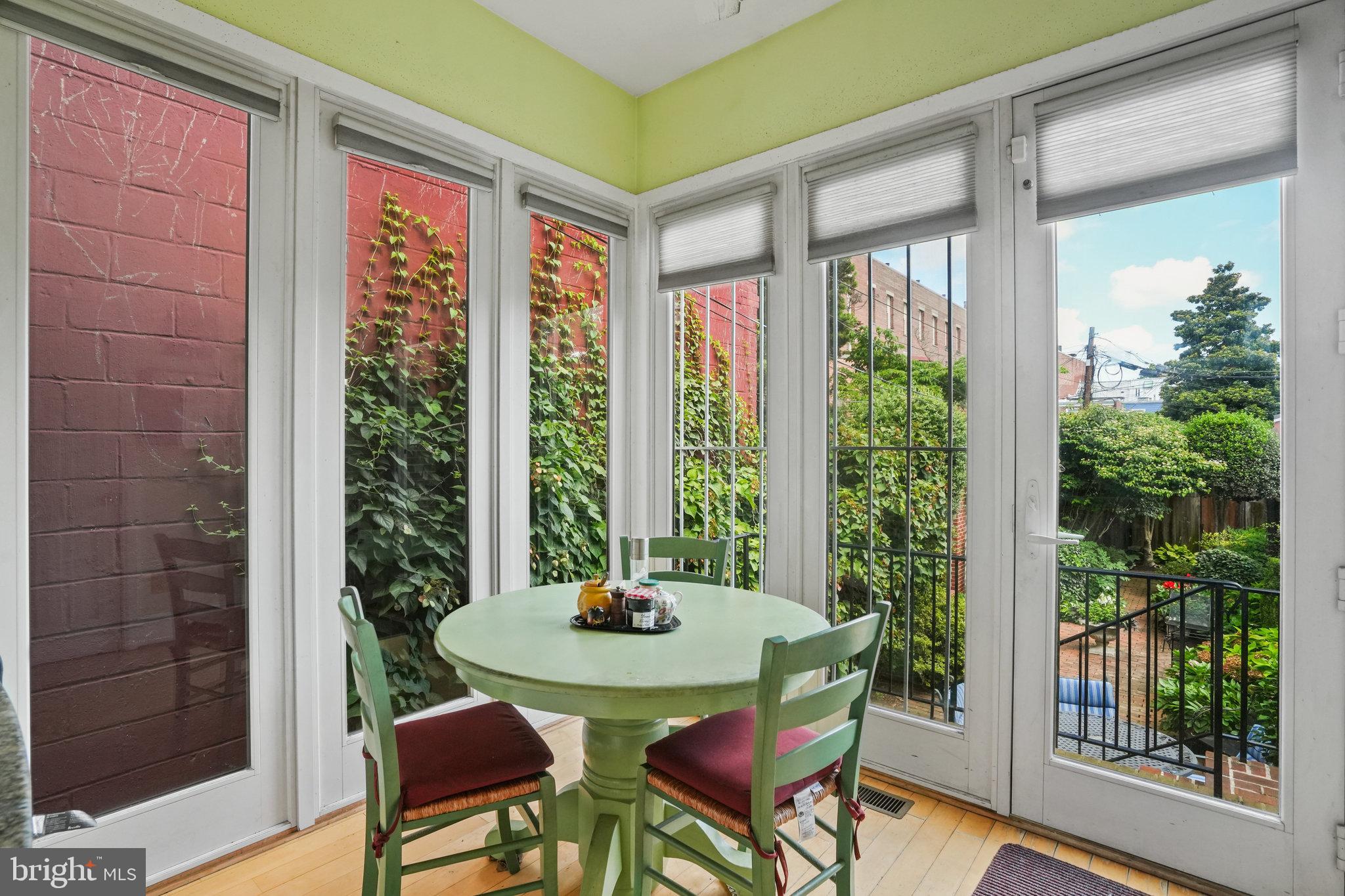 628 A Street Northeast Washington, DC 20002 - Photo 10 of 29 a view of a dining room with furniture window and wooden floor