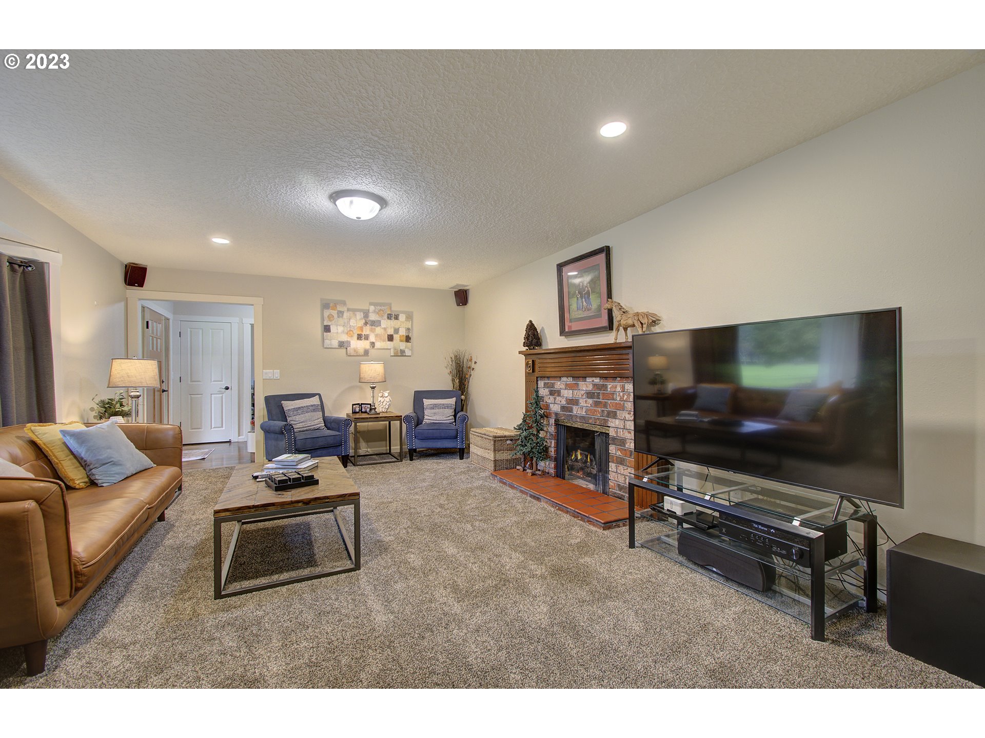 13025 Northeast Prairie Road Brush Prairie, WA 98606 - Photo 12 of 47 a living room with furniture and a flat screen tv