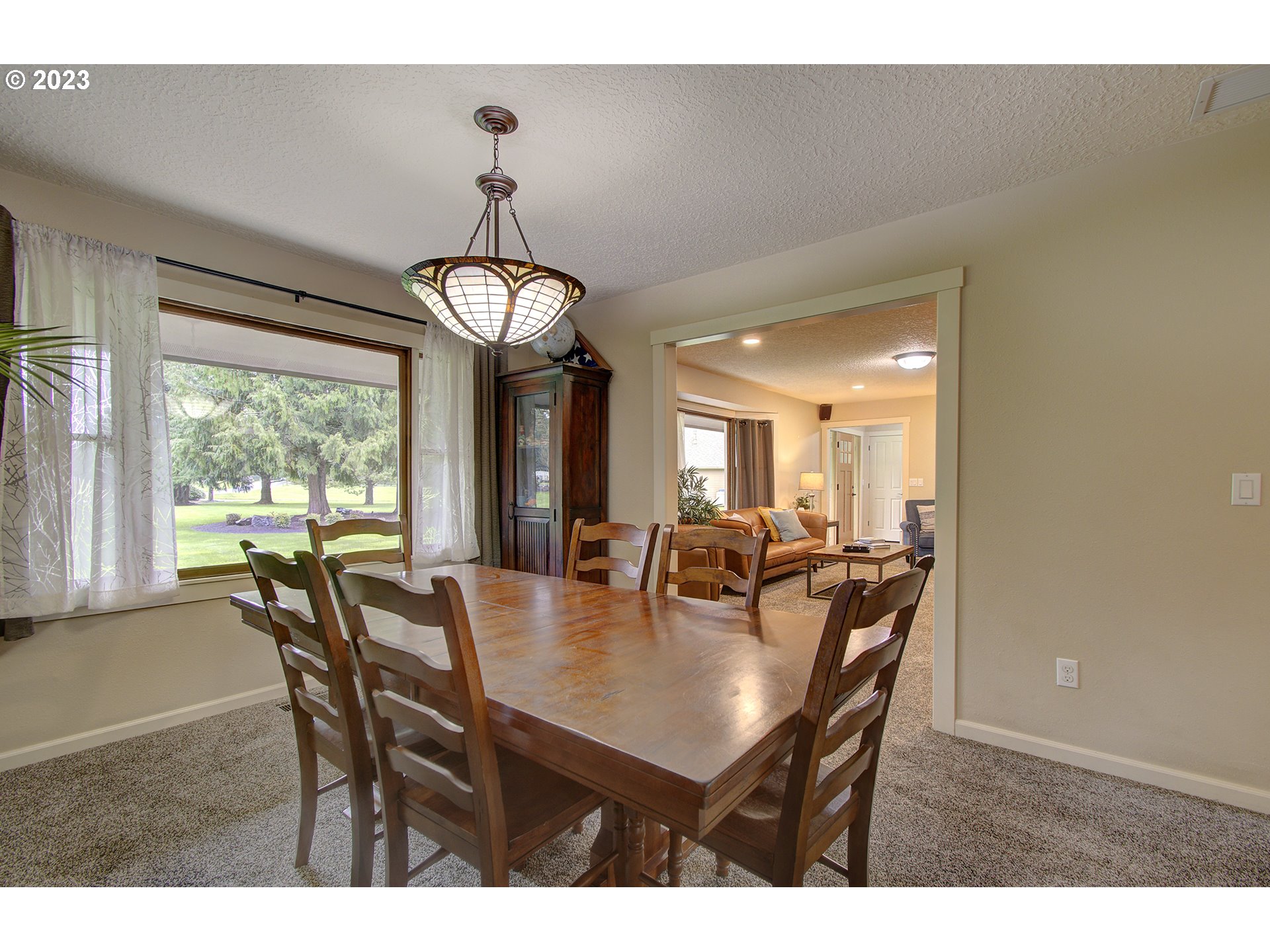 13025 Northeast Prairie Road Brush Prairie, WA 98606 - Photo 16 of 47 a view of a dining room with furniture window and outside view