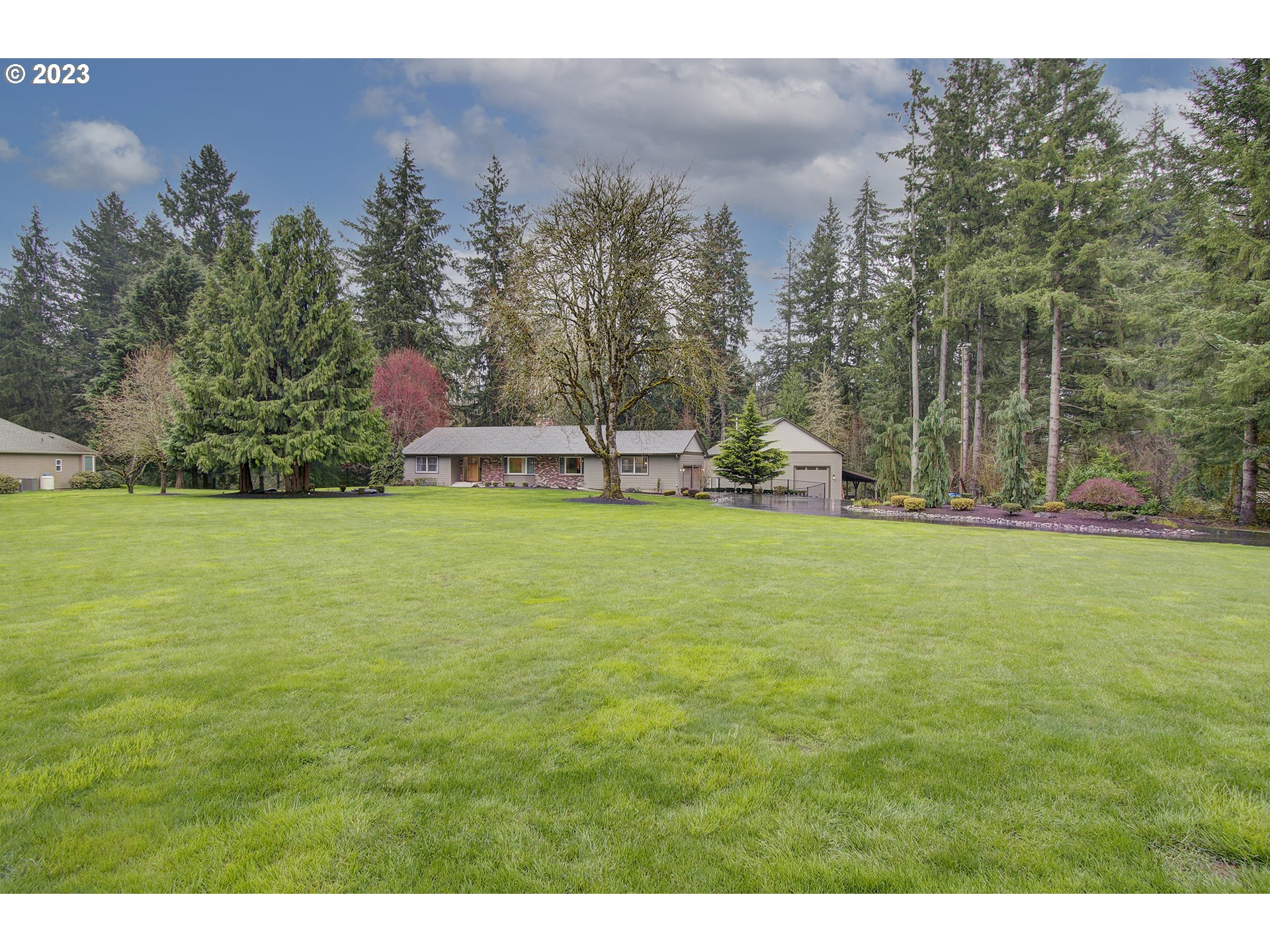 13025 Northeast Prairie Road Brush Prairie, WA 98606 - Photo 2 of 47 a view of a garden and basketball court