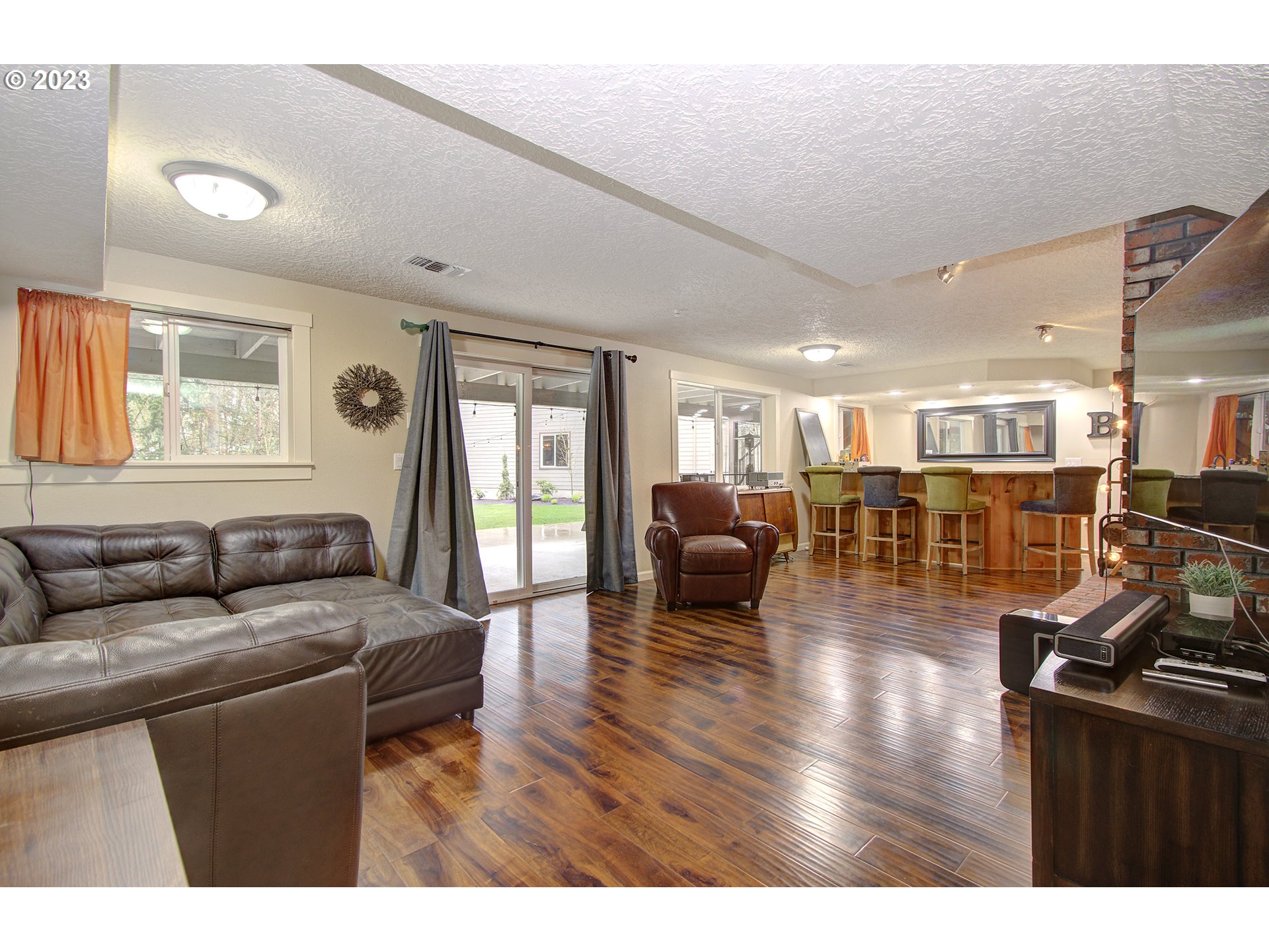 13025 Northeast Prairie Road Brush Prairie, WA 98606 - Photo 23 of 47 a living room with furniture and a wooden floor