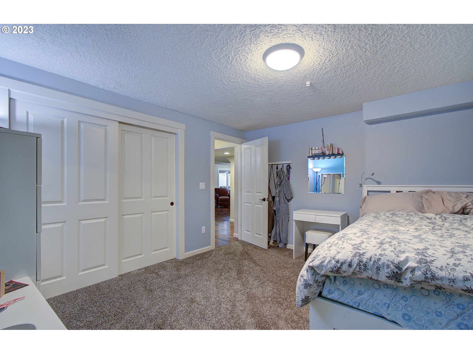 13025 Northeast Prairie Road Brush Prairie, WA 98606 - Photo 29 of 47 a bedroom with a bed and a view of bathroom