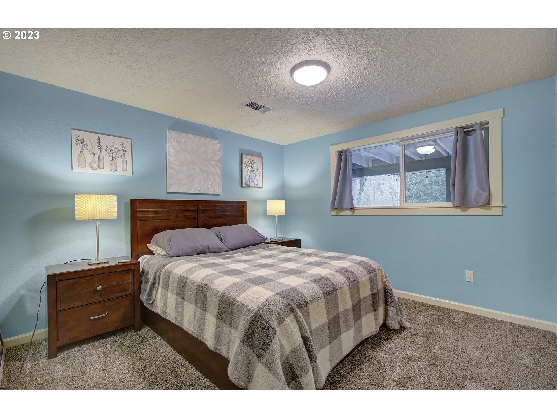 13025 Northeast Prairie Road Brush Prairie, WA 98606 - Photo 31 of 47 a bedroom with a bed and a night stand