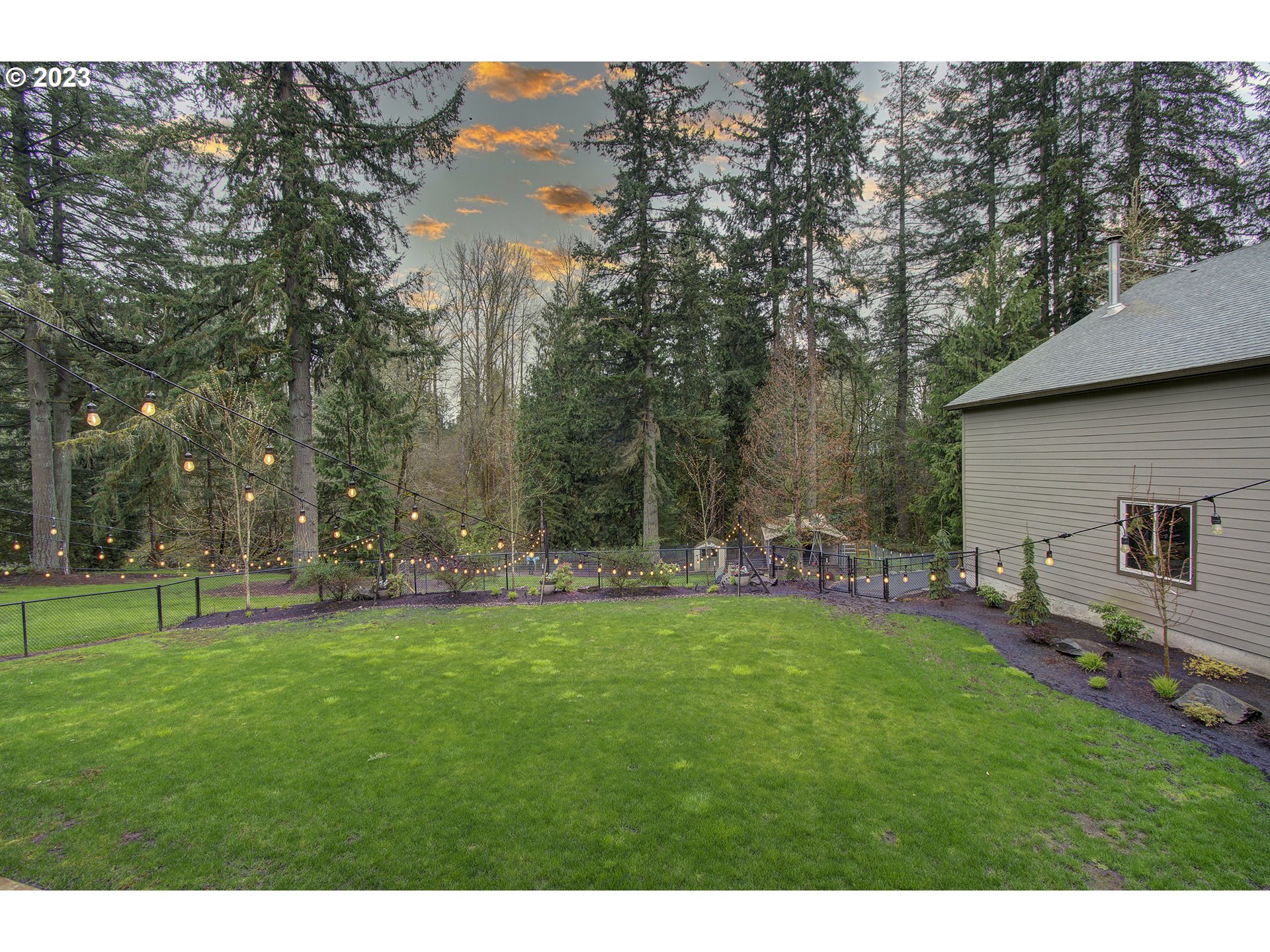 13025 Northeast Prairie Road Brush Prairie, WA 98606 - Photo 36 of 47 a backyard of a house with table and chairs