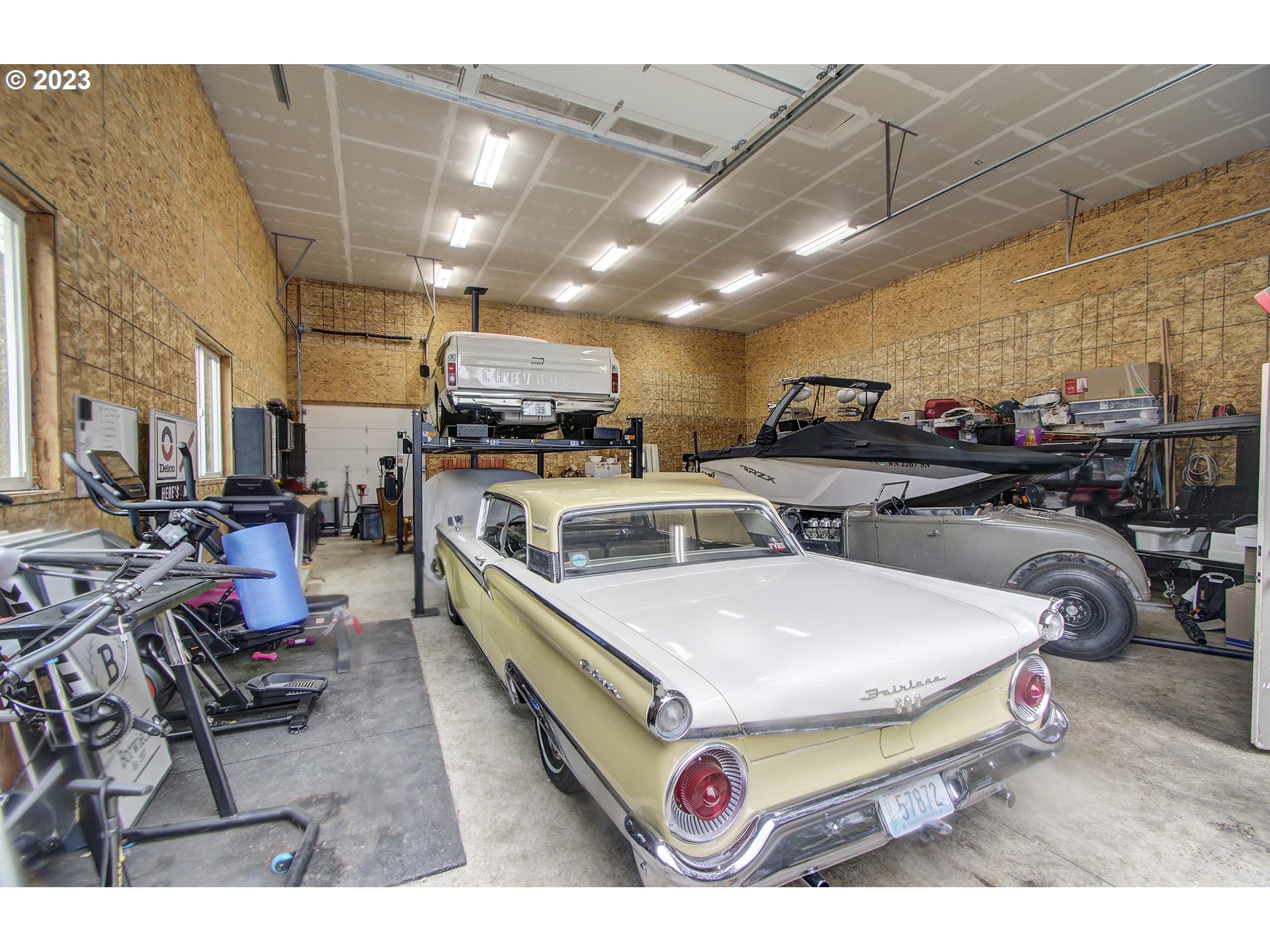 13025 Northeast Prairie Road Brush Prairie, WA 98606 - Photo 47 of 47 a room with lots of furniture and a chandelier