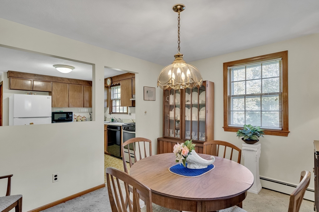 42 Grapevine Avenue Lexington, MA 02421 - Photo 11 of 36 a view of a dining room with furniture window and wooden floor