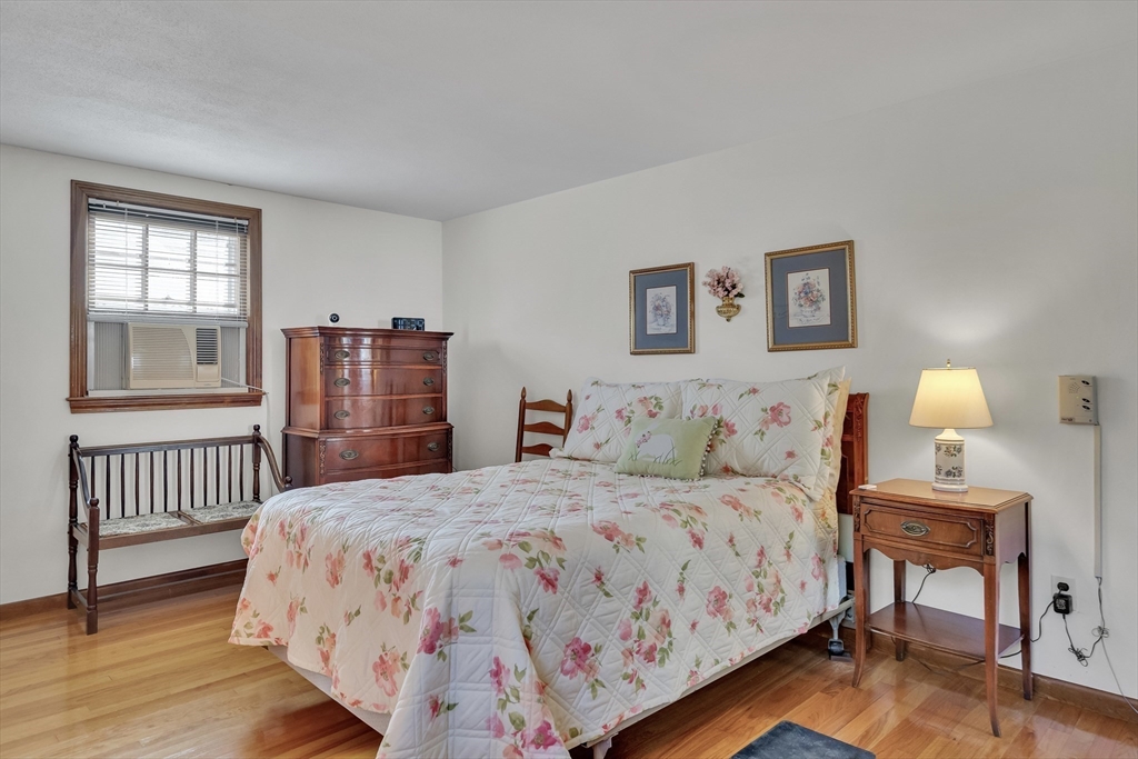 42 Grapevine Avenue Lexington, MA 02421 - Photo 18 of 36 a bedroom with a bed and a table