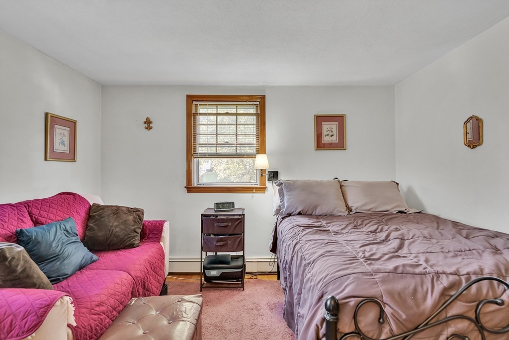 42 Grapevine Avenue Lexington, MA 02421 - Photo 21 of 36 a bed room with a bed and a couch