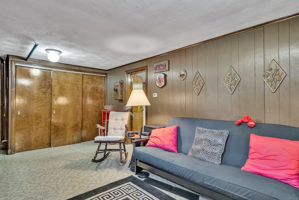 42 Grapevine Avenue Lexington, MA 02421 - Photo 27 of 36 a living room with furniture and a bathtub