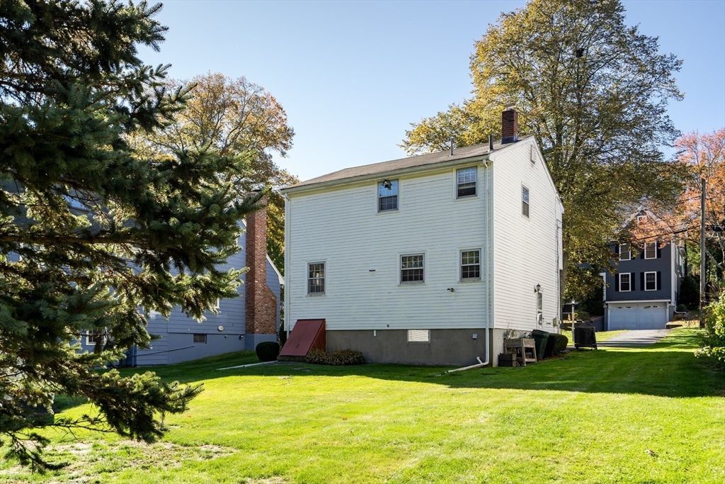 42 Grapevine Avenue Lexington, MA 02421 - Photo 33 of 36 a view of a white house with a yard