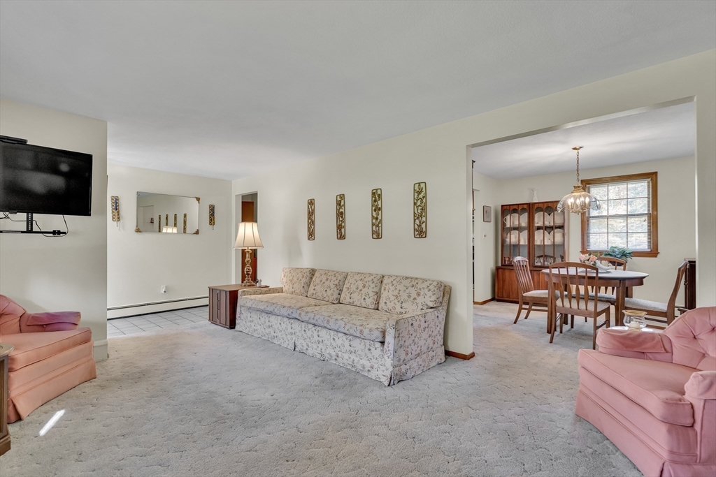 42 Grapevine Avenue Lexington, MA 02421 - Photo 7 of 36 a living room with furniture and a flat screen tv