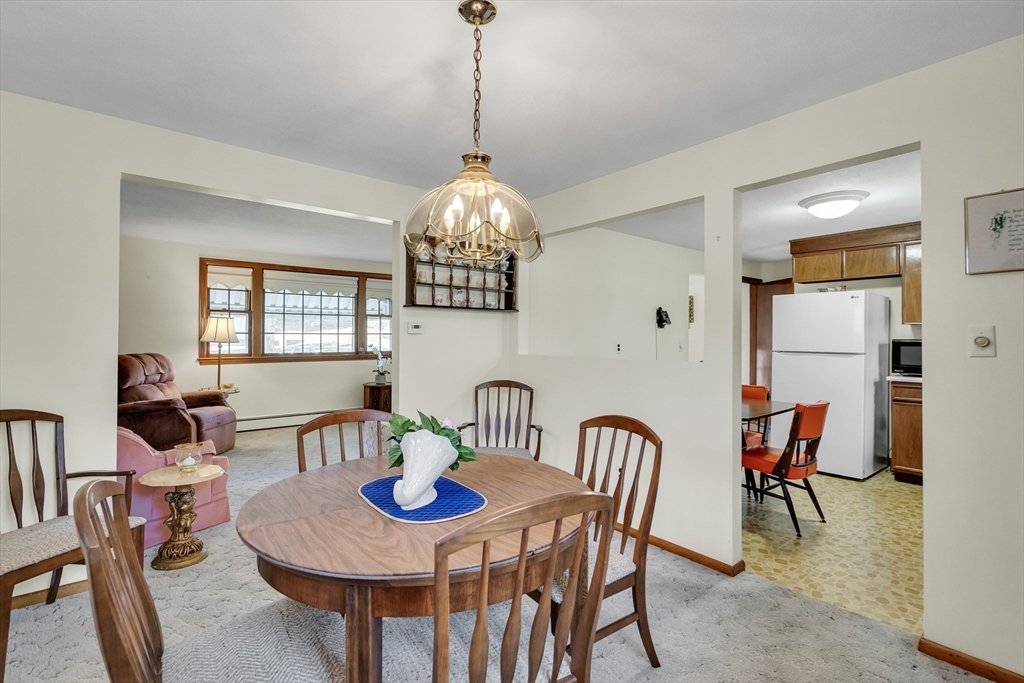 42 Grapevine Avenue Lexington, MA 02421 - Photo 8 of 36 a view of a dining room with furniture and chandelier
