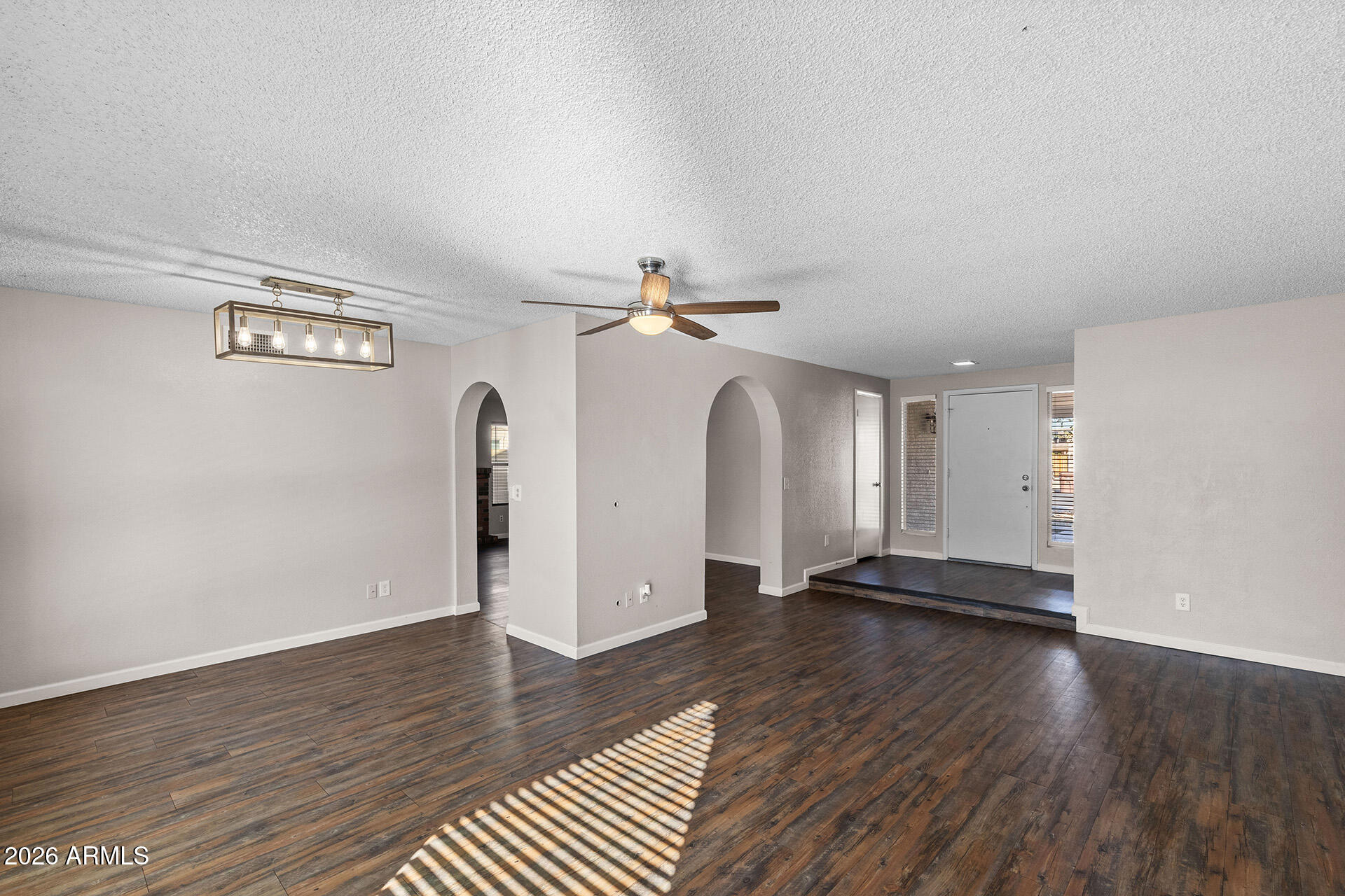 7267 West Charter Oak Road Peoria, AZ 85381 - Photo 10 of 45 a view of empty room with wooden floor