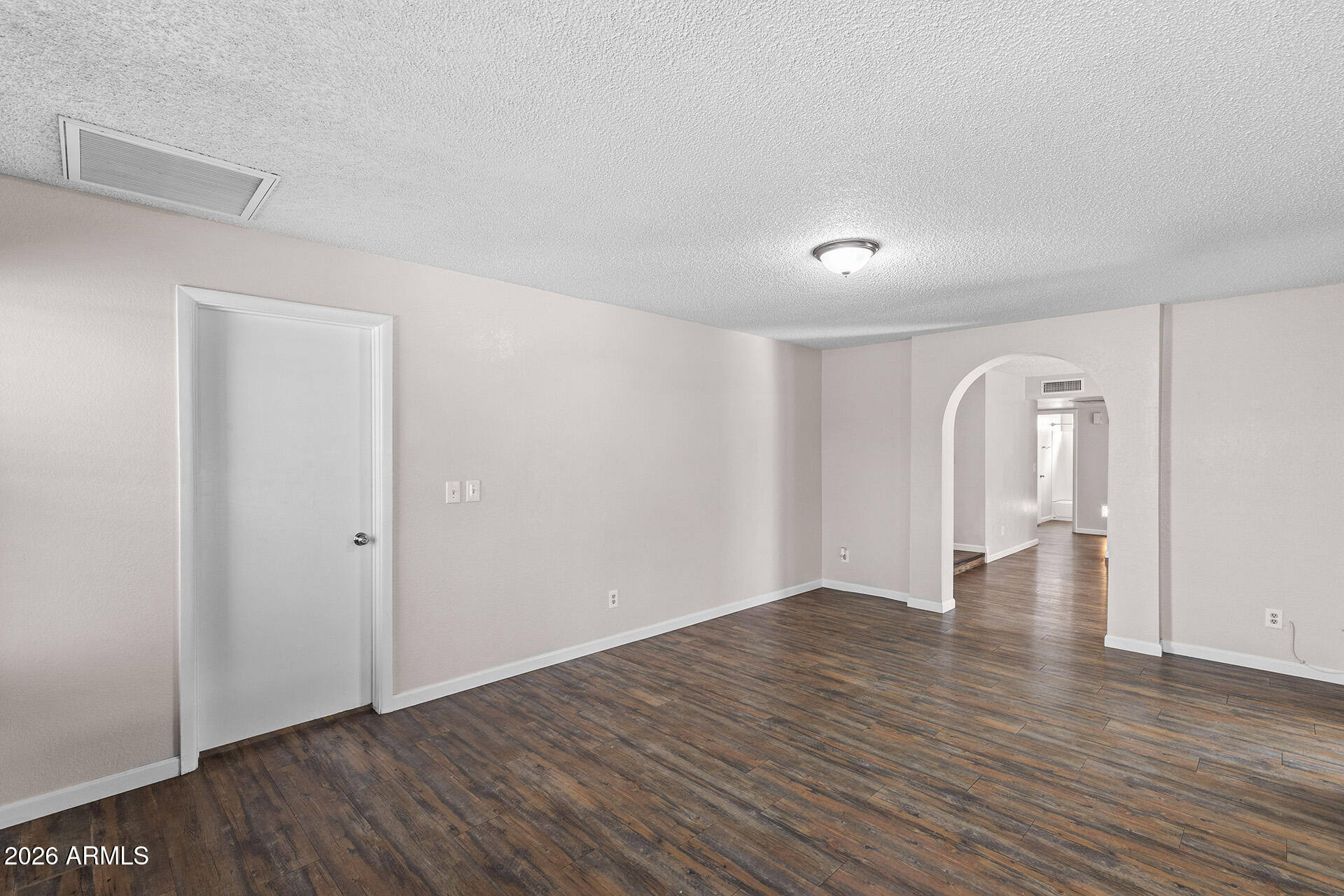 7267 West Charter Oak Road Peoria, AZ 85381 - Photo 15 of 45 a view of empty room with wooden floor