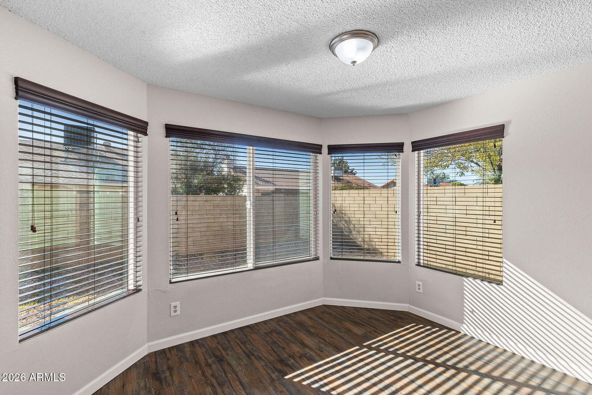 7267 West Charter Oak Road Peoria, AZ 85381 - Photo 17 of 45 a view of an empty room with a window