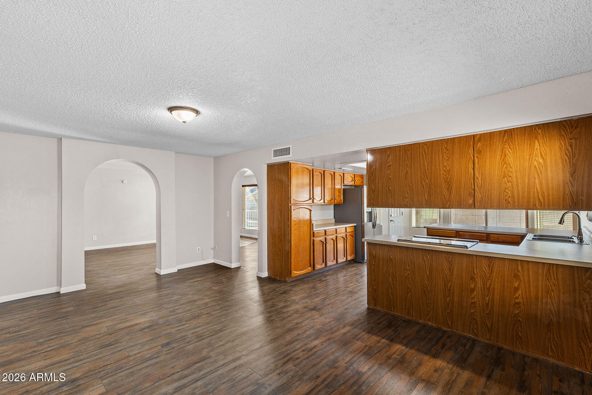 7267 West Charter Oak Road Peoria, AZ 85381 - Photo 18 of 45 a view of a kitchen with a sink and cabinets