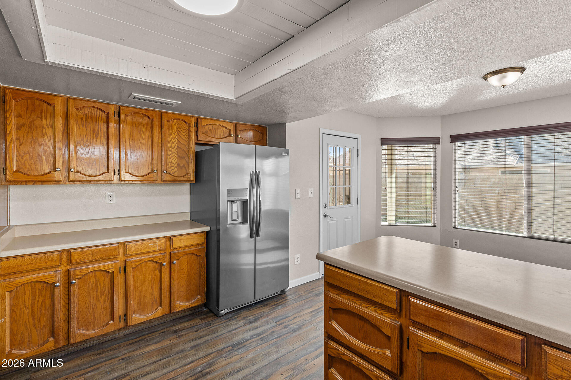7267 West Charter Oak Road Peoria, AZ 85381 - Photo 22 of 45 a kitchen with stainless steel appliances granite countertop a refrigerator and a sink
