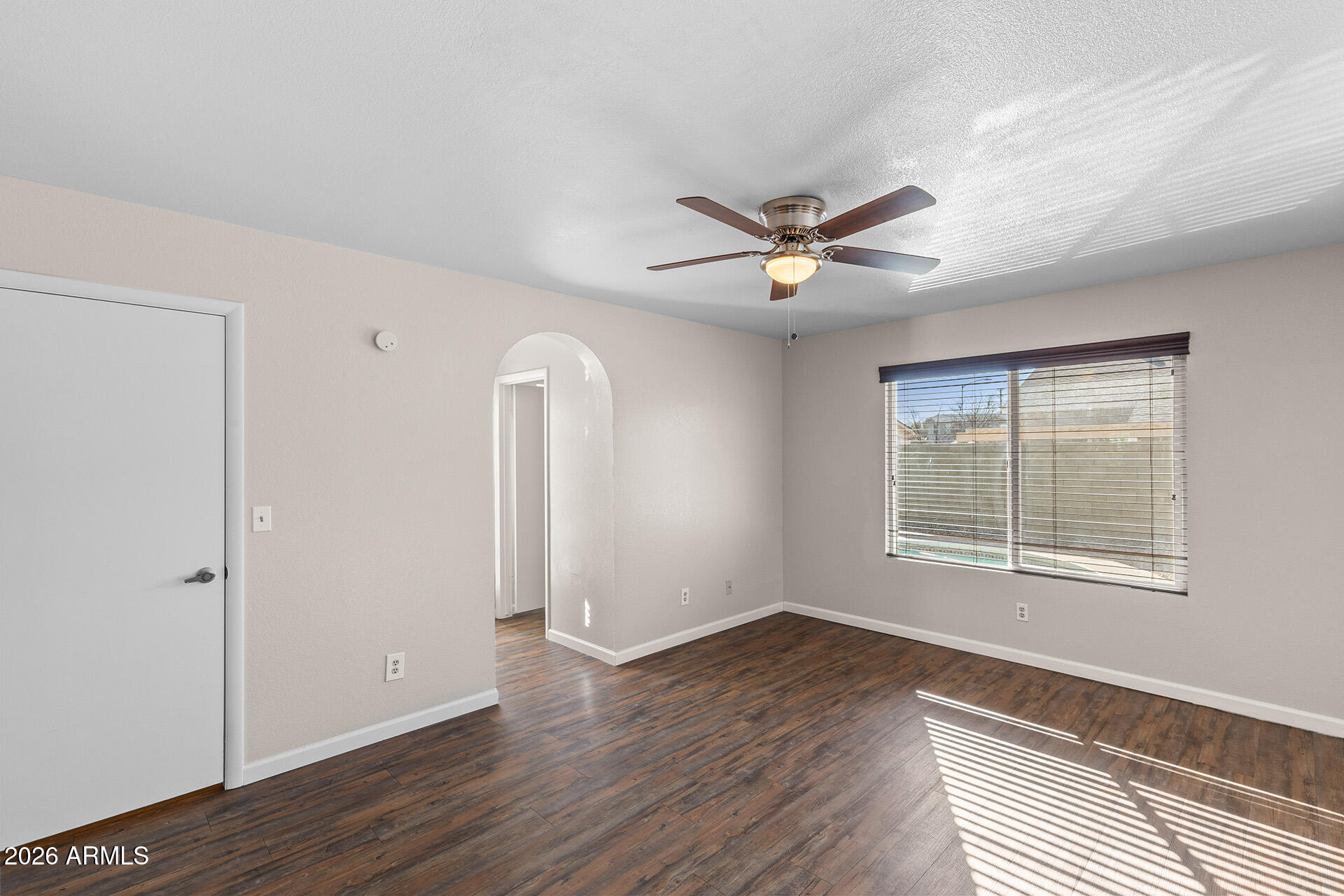 7267 West Charter Oak Road Peoria, AZ 85381 - Photo 32 of 45 wooden floor in an empty room with a window