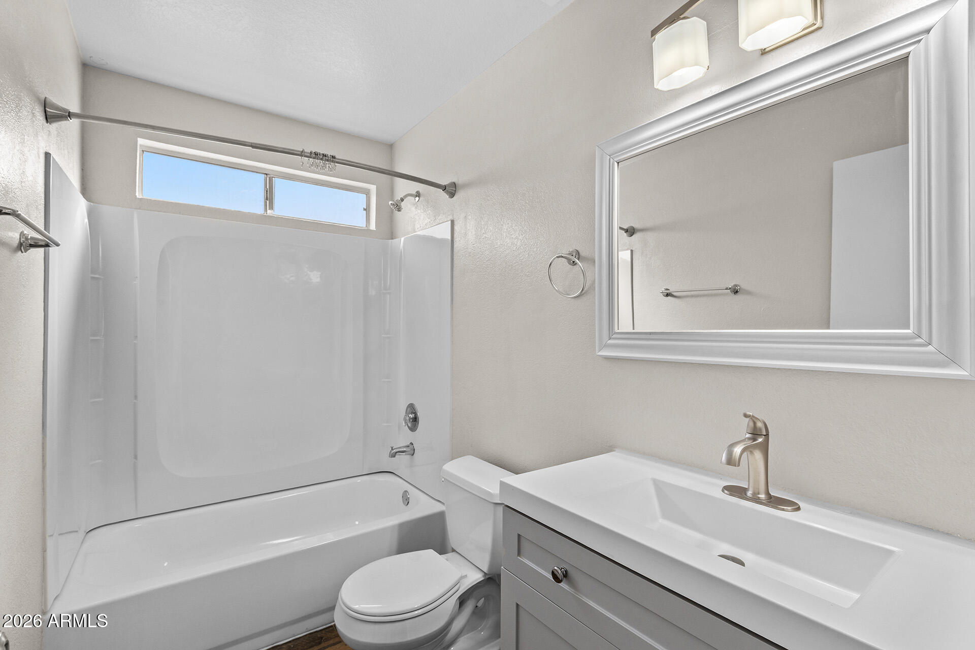 7267 West Charter Oak Road Peoria, AZ 85381 - Photo 36 of 45 a bathroom with a sink toilet and shower