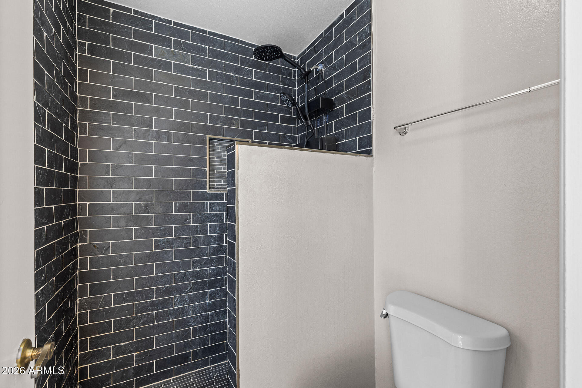 7267 West Charter Oak Road Peoria, AZ 85381 - Photo 37 of 45 a bathroom with a toilet and a shower