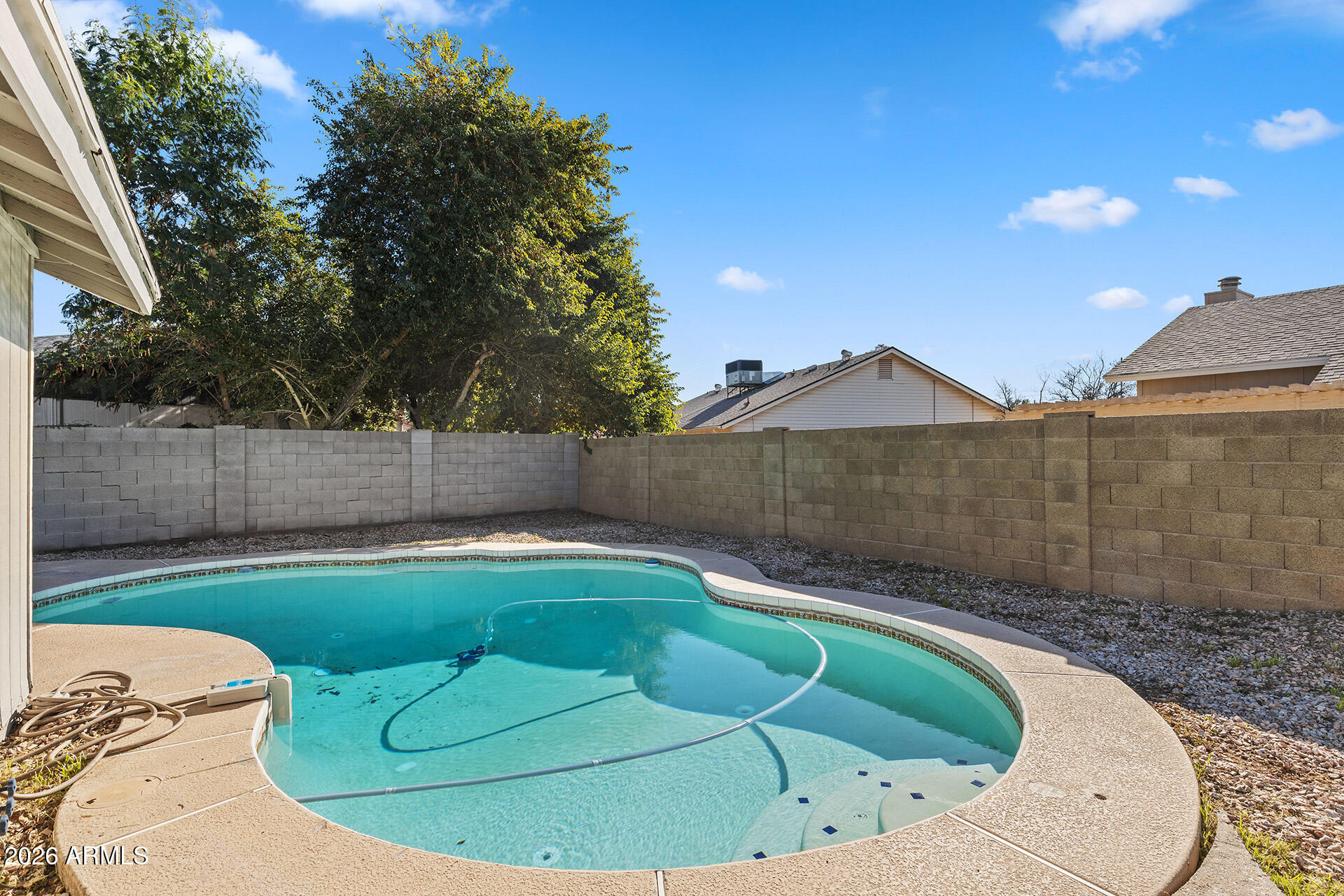 7267 West Charter Oak Road Peoria, AZ 85381 - Photo 42 of 45 a view of a swimming pool in a backyard