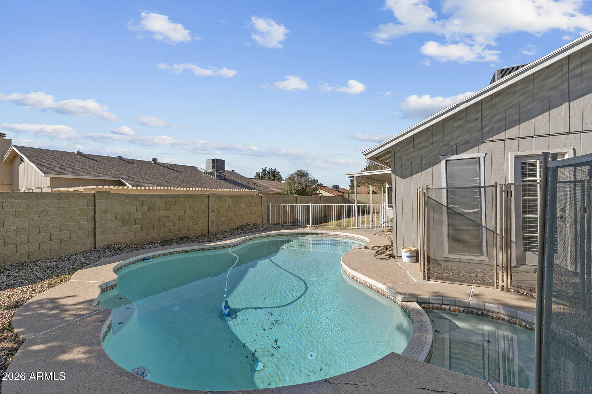 7267 West Charter Oak Road Peoria, AZ 85381 - Photo 44 of 45 a view of a swimming pool with a backyard