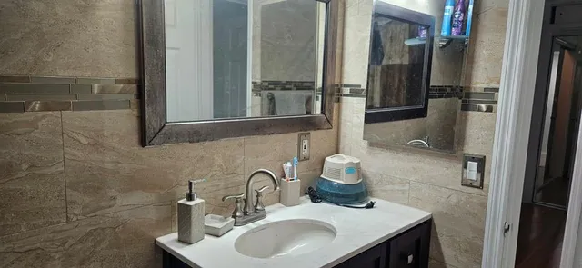 a bathroom with a sink and a mirror