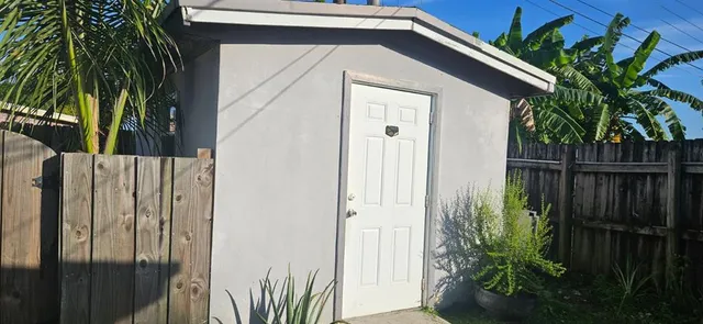 a view of a house with a small yard