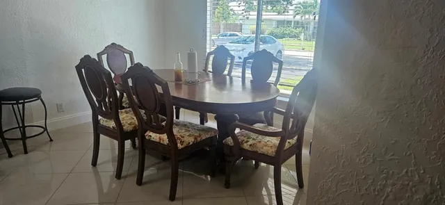 a view of a dining room with furniture window and outside view