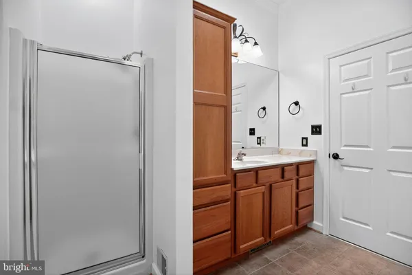 a bathroom with a double vanity sink and mirror