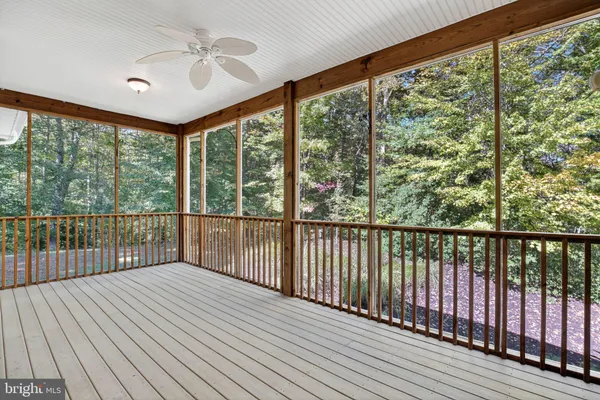 a view of a balcony with wooden floor