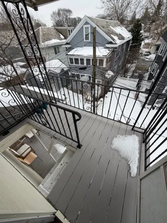 a view of a house with backyard and deck