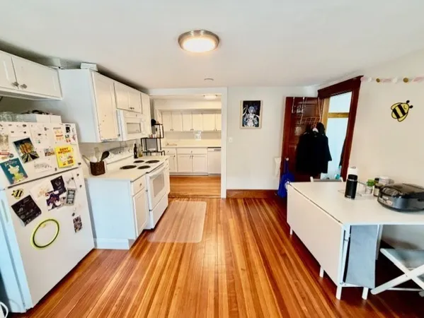 a view of a kitchen with sink and dishwasher