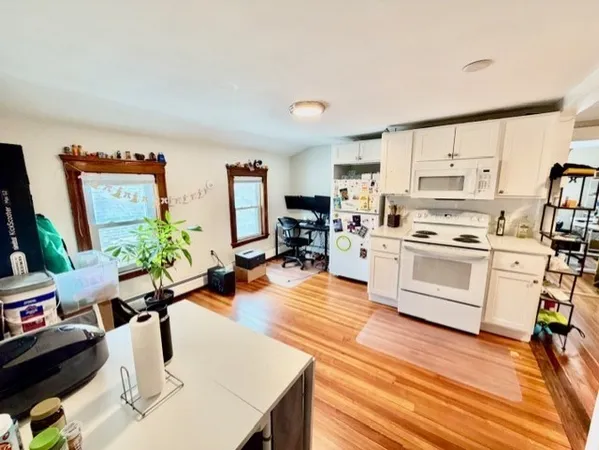 a kitchen with stainless steel appliances a stove a sink dishwasher and a refrigerator