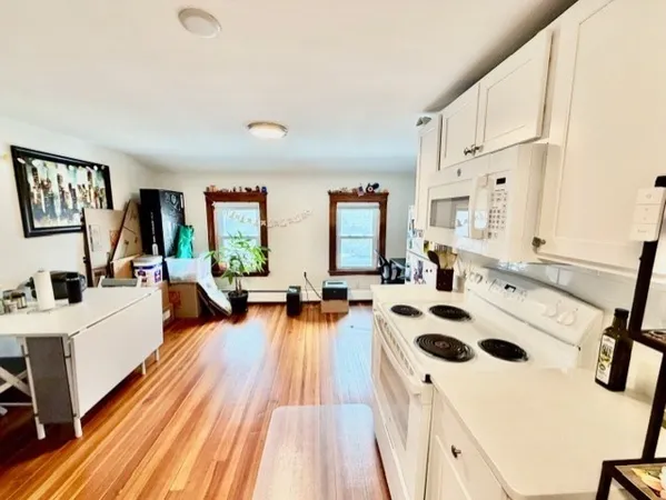 a very nice looking living room with a large window