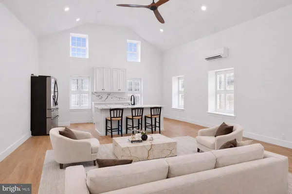 a living room with furniture and a large window