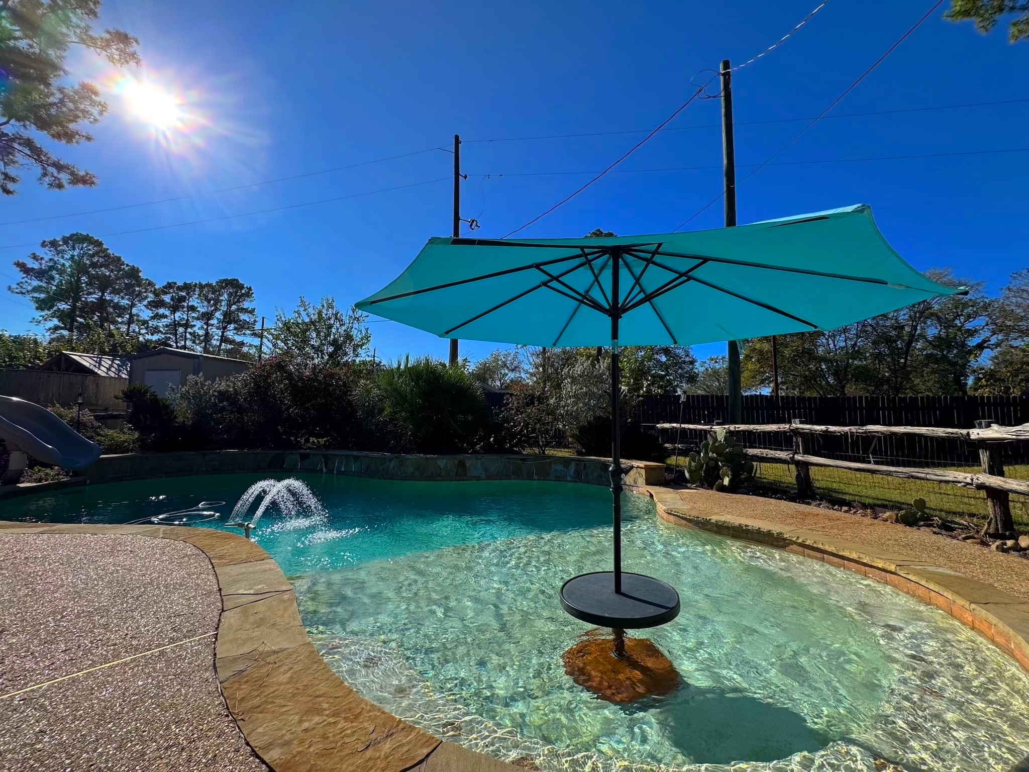 a swimming pool with an outdoor seating and yard