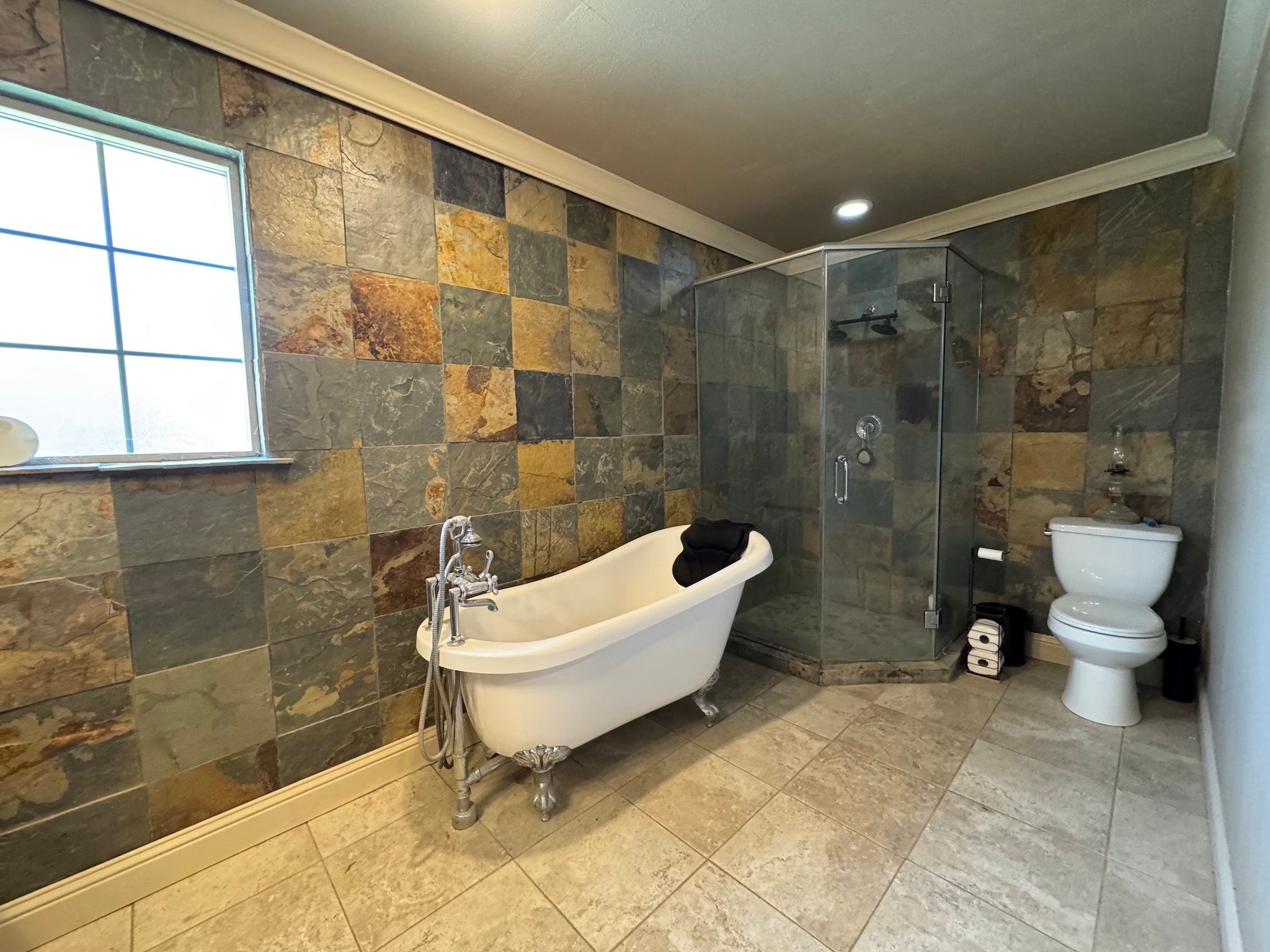 114 Elmwood Street Huntsville, TX 77320 - Photo 11 of 18 a bathroom with a toilet and a shower