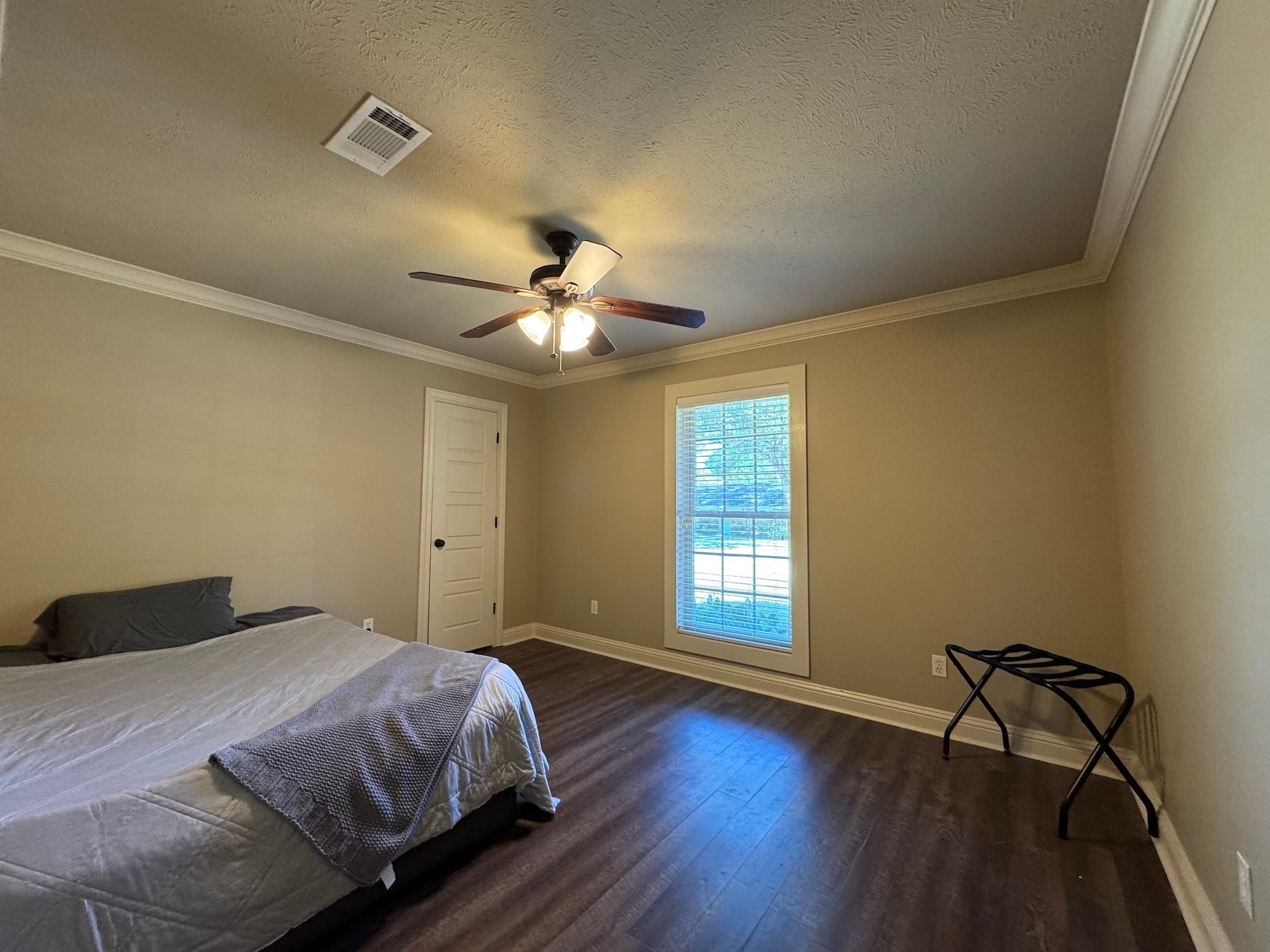 114 Elmwood Street Huntsville, TX 77320 - Photo 14 of 18 a bedroom with a bed and window