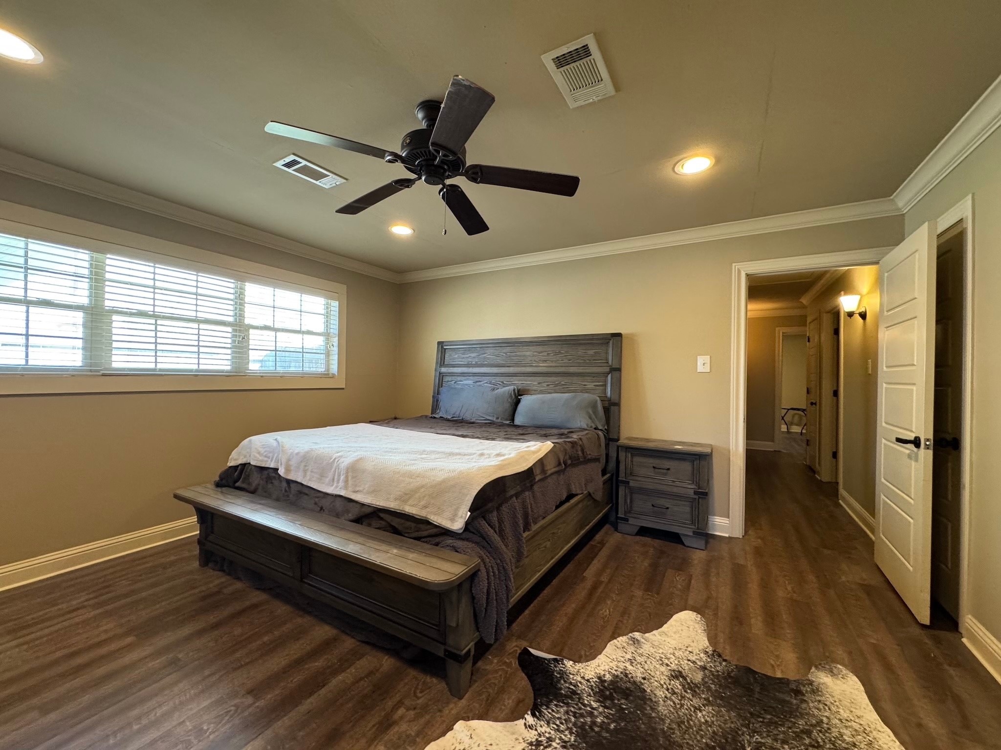 114 Elmwood Street Huntsville, TX 77320 - Photo 10 of 18 a bedroom with a bed and window