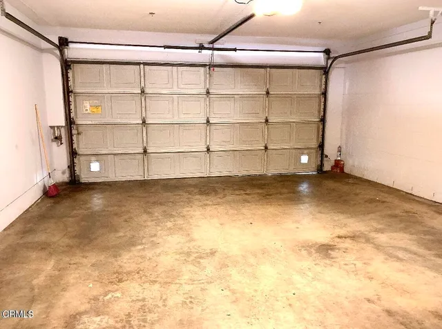 a view of a room with wooden floor and cabinet