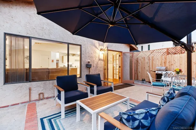 a outdoor space with furniture and umbrella