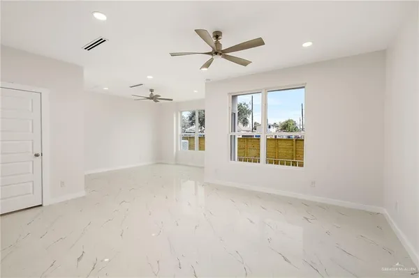 a view of an empty room with a window