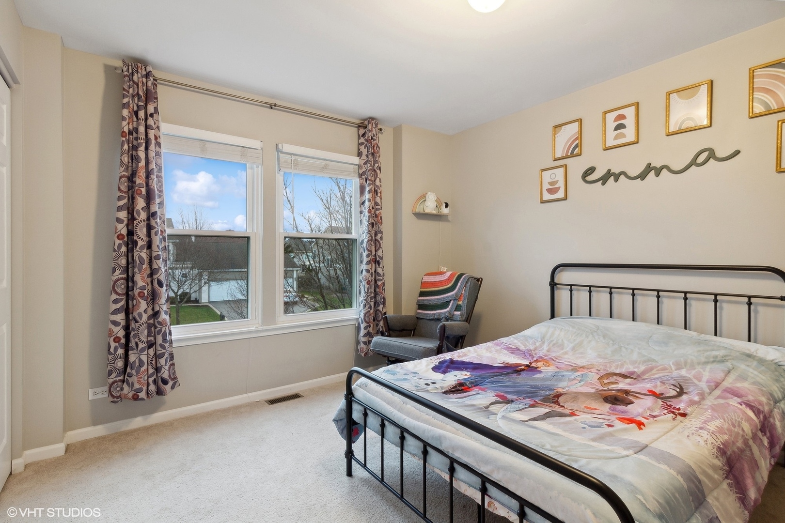 1004 Vineyard Lane Aurora, IL 60502 - Photo 14 of 24 a bedroom with a bed and a window