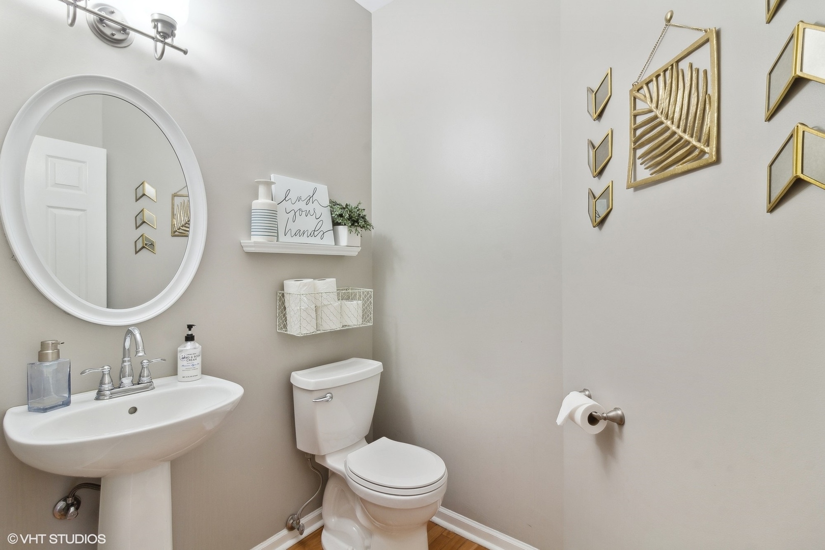 1004 Vineyard Lane Aurora, IL 60502 - Photo 8 of 24 a bathroom with a toilet sink and mirror
