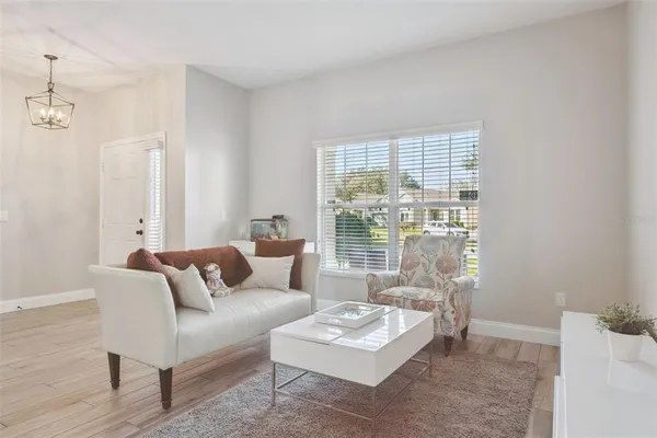 a living room with furniture and a window