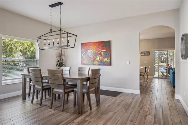 a view of a dining room with furniture window and wooden floor