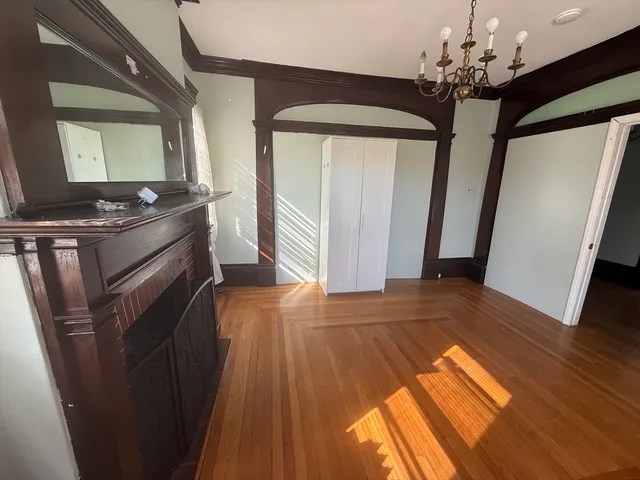 a view of a kitchen from a hallway