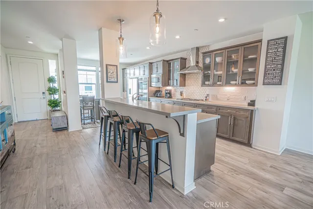 a kitchen with stainless steel appliances a stove and a refrigerator
